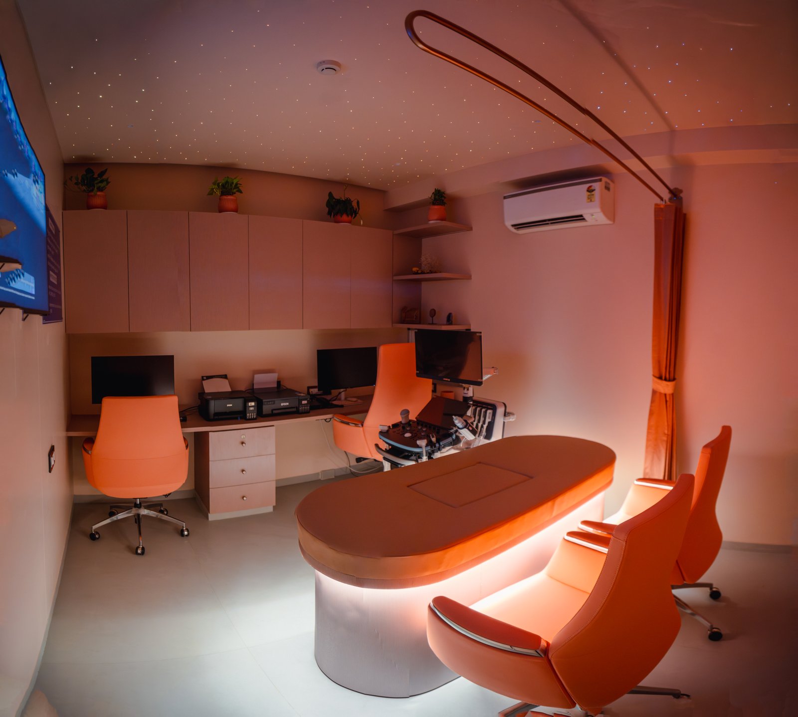 Ultrasound suite at ShivAnuj — warm, calming interiors with a starry-roof ceiling for comfortable scans